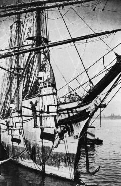 picture of sailor chipping rust